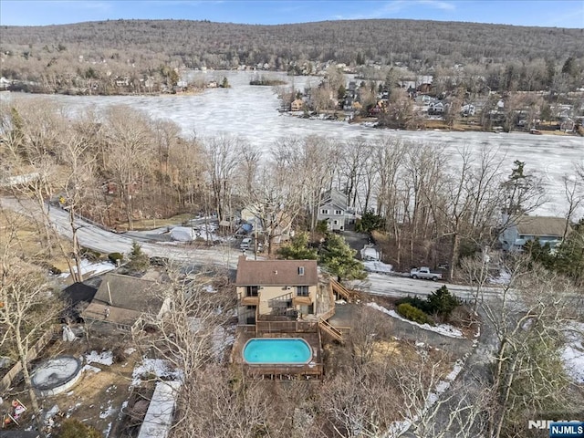 snowy aerial view with a residential view