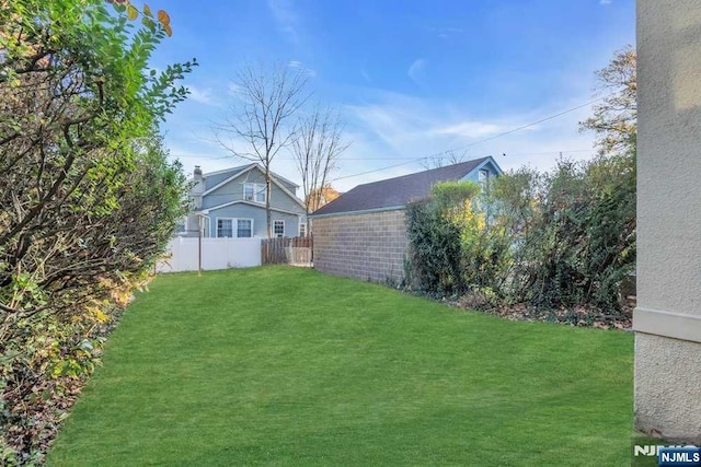 view of yard with fence