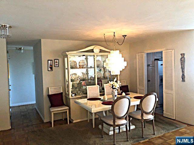 dining space with an inviting chandelier