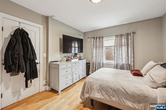 bedroom with light wood finished floors