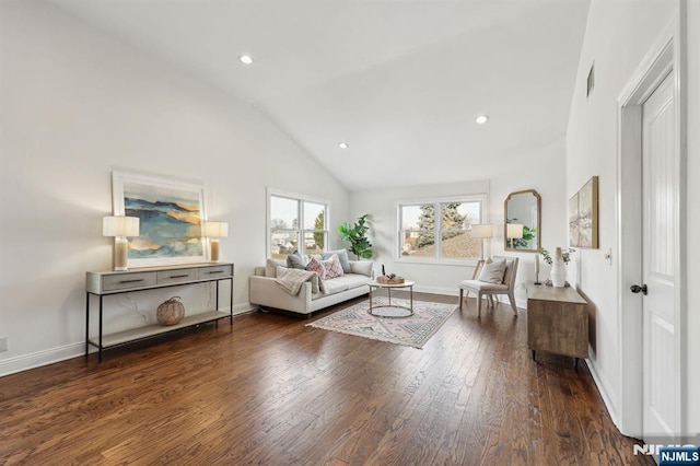 living area with recessed lighting, visible vents, baseboards, and wood finished floors