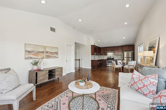 living room featuring visible vents, dark wood finished floors, and recessed lighting