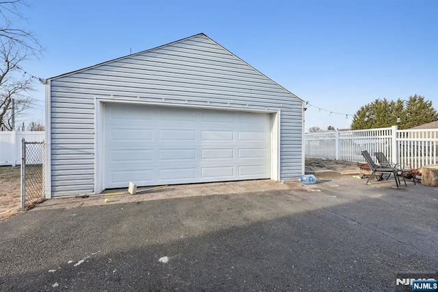 garage with fence