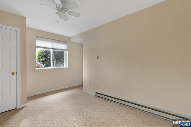 unfurnished room with baseboards, baseboard heating, a ceiling fan, and light colored carpet