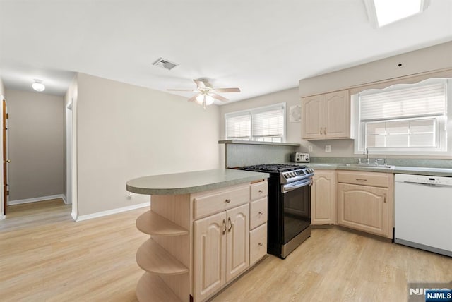 kitchen with open shelves, stainless steel range with gas stovetop, dishwasher, a peninsula, and a sink