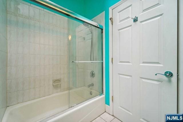 full bath featuring enclosed tub / shower combo and tile patterned floors