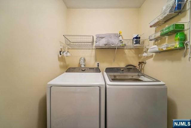 laundry room with washing machine and dryer and laundry area