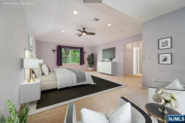 carpeted bedroom with visible vents and recessed lighting