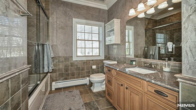 bathroom with bath / shower combo with glass door, a baseboard radiator, tile walls, and crown molding