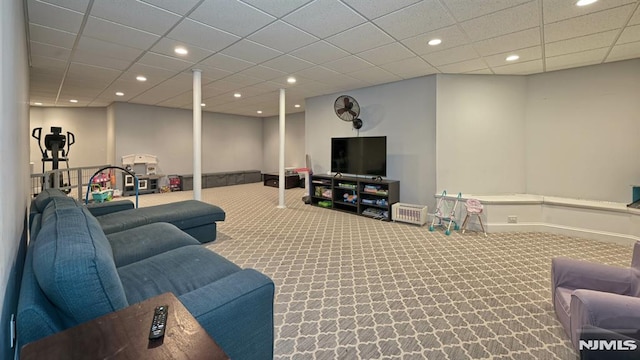 carpeted living room with baseboards, a drop ceiling, and recessed lighting