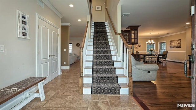 stairs featuring baseboards, ornamental molding, visible vents, and recessed lighting