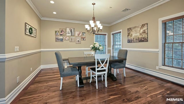 dining room with baseboards, ornamental molding, wood finished floors, an inviting chandelier, and baseboard heating