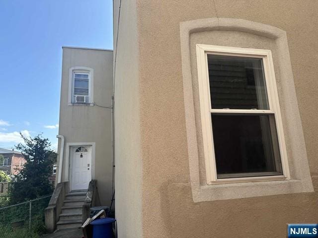 exterior space with stucco siding