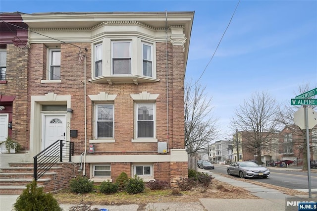 multi unit property featuring brick siding