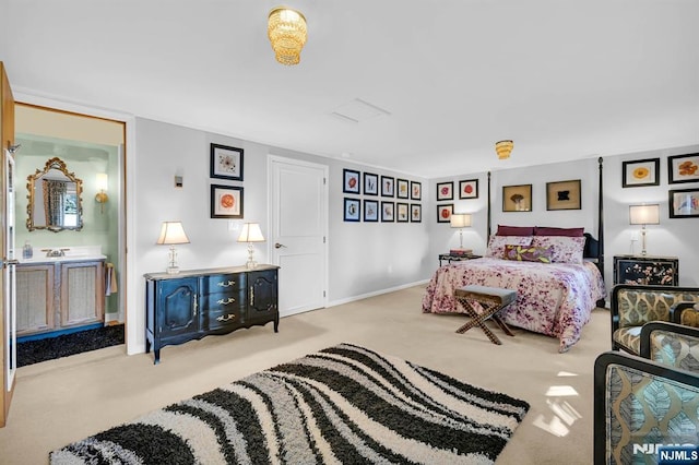 bedroom featuring carpet, baseboards, and ensuite bathroom