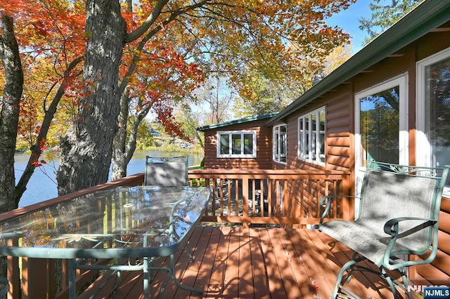 wooden deck with outdoor dining space