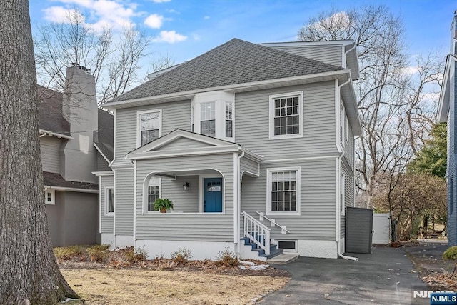 view of front of home with roof with shingles