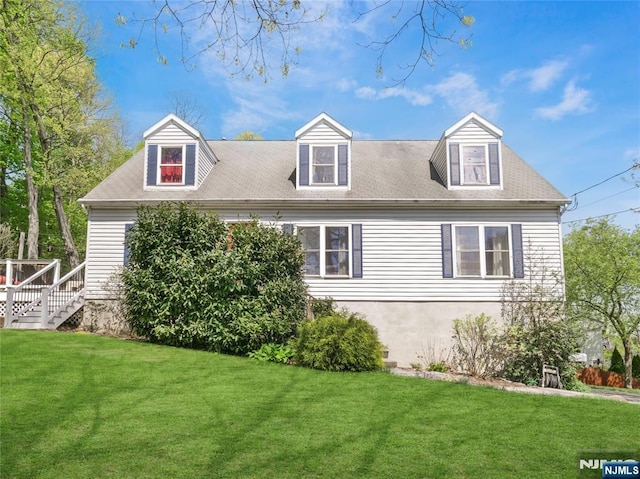 view of side of property with a lawn