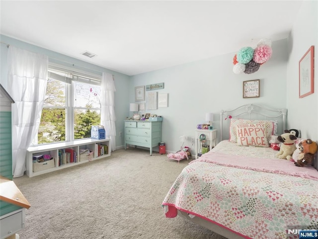 bedroom with carpet floors and visible vents