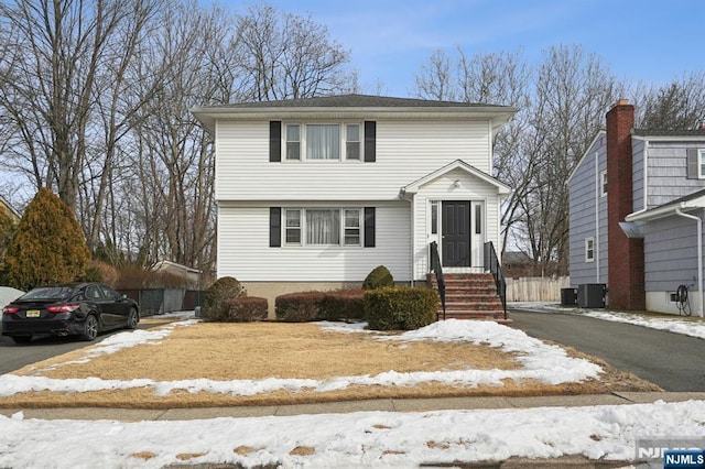 colonial home with central air condition unit