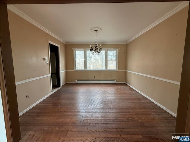 unfurnished dining area featuring dark wood-style flooring, ornamental molding, baseboard heating, and a notable chandelier