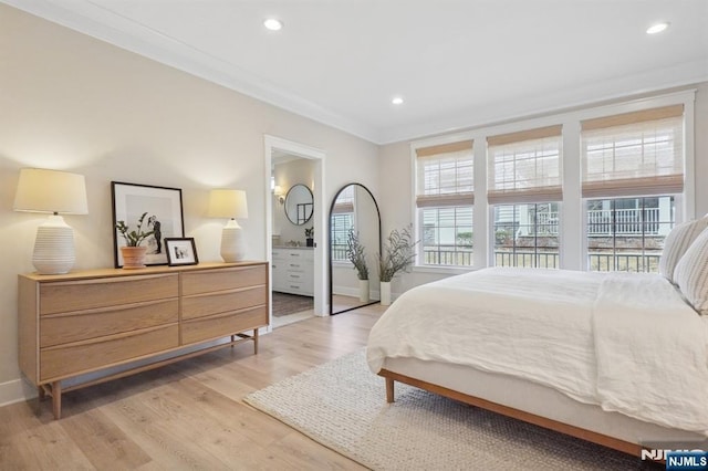 bedroom with baseboards, ensuite bathroom, crown molding, light wood-style floors, and recessed lighting