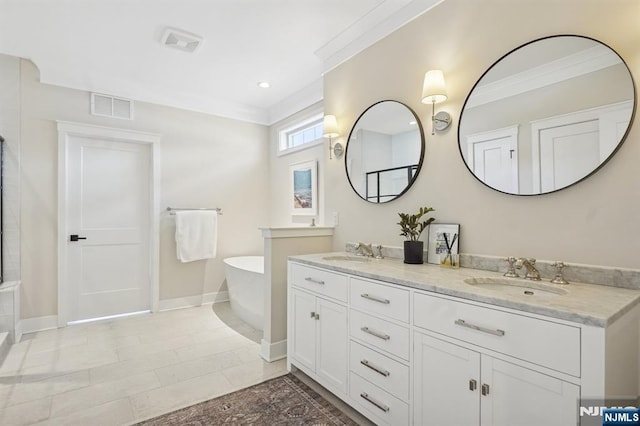 bathroom featuring a sink, visible vents, ornamental molding, a soaking tub, and double vanity