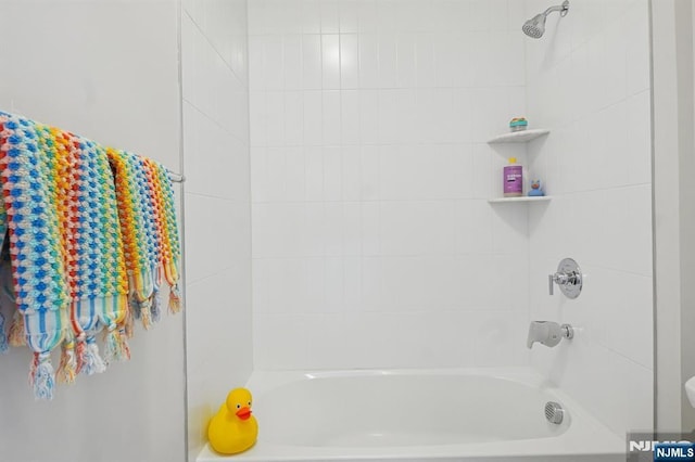 bathroom with shower / tub combination