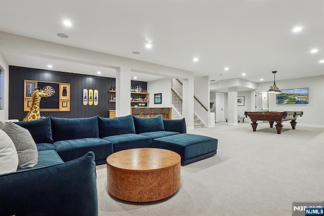 living area with stairs, light carpet, and recessed lighting