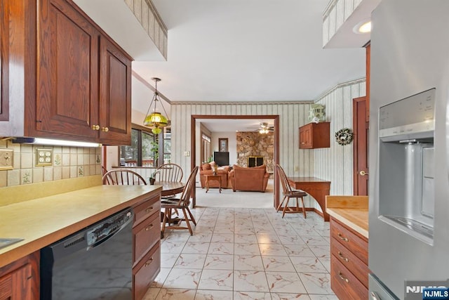 kitchen featuring pendant lighting, black dishwasher, marble finish floor, light countertops, and stainless steel fridge with ice dispenser