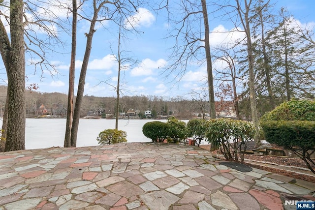 view of patio / terrace featuring a water view