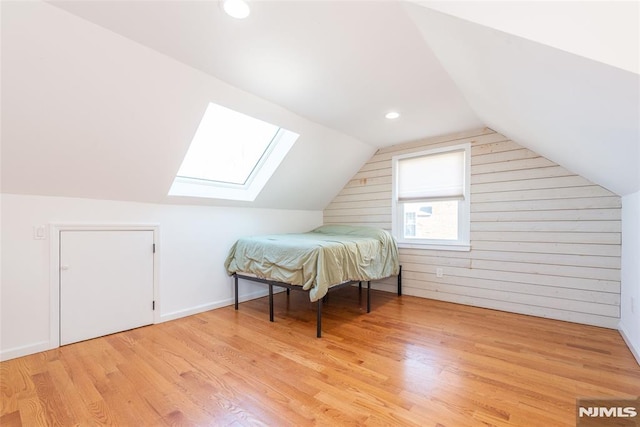 bonus room featuring vaulted ceiling, recessed lighting, wood finished floors, and baseboards