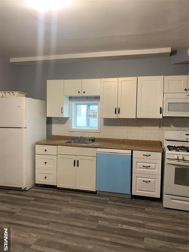 kitchen featuring dark wood-style flooring, white appliances, and decorative backsplash