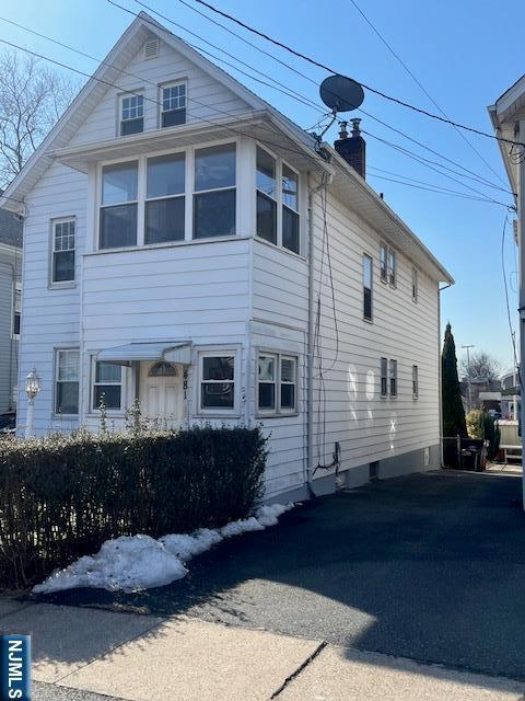 view of home's exterior with a chimney