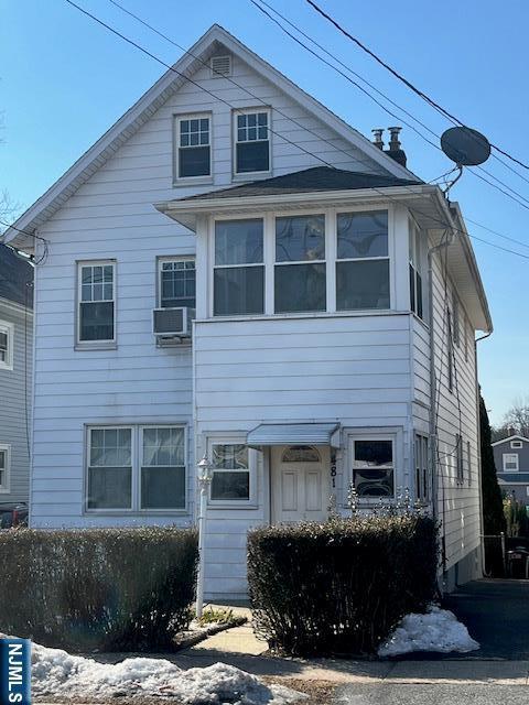 view of front of home with cooling unit