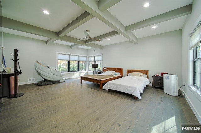 bedroom with beam ceiling, recessed lighting, baseboards, and wood-type flooring