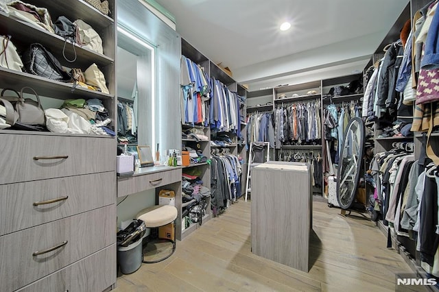 spacious closet with light wood-style flooring