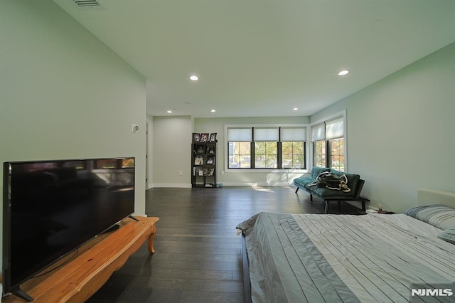 bedroom featuring recessed lighting, dark wood-style floors, and baseboards