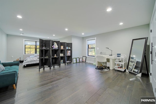 interior space with recessed lighting, baseboards, and dark wood-type flooring