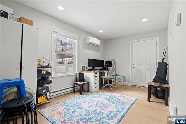 home office with recessed lighting, light wood-style floors, a baseboard radiator, and a wall mounted AC