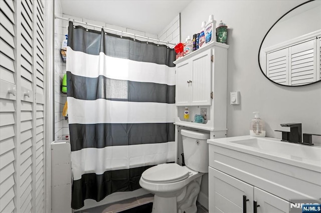 full bath featuring shower / bath combination with curtain, a closet, vanity, and toilet