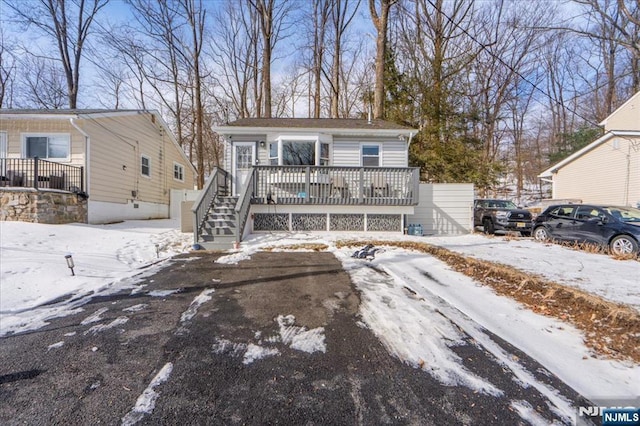 view of front of home with a wooden deck