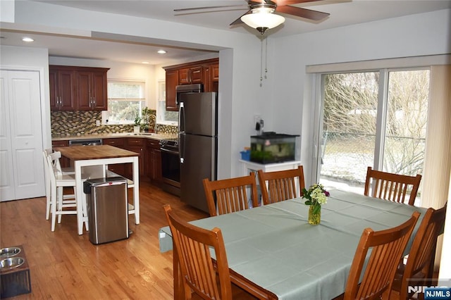 dining room with ceiling fan, light wood-type flooring, and recessed lighting