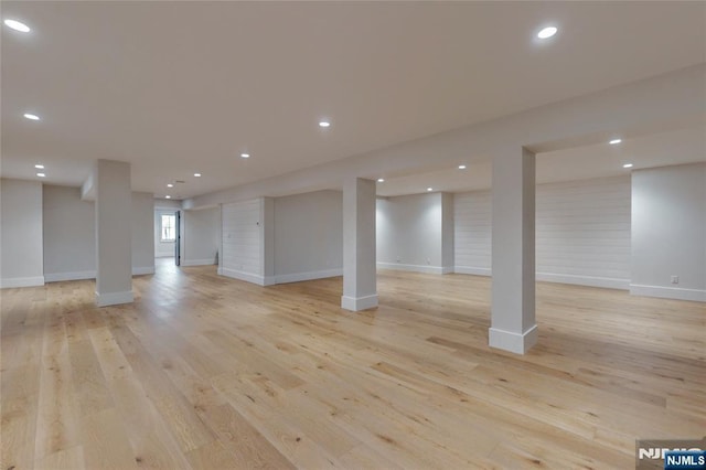 basement featuring recessed lighting, light wood-style flooring, and baseboards