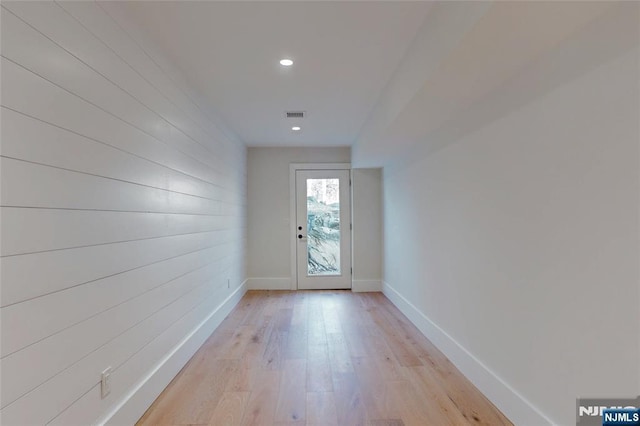 doorway to outside with light wood-style flooring, recessed lighting, baseboards, and visible vents