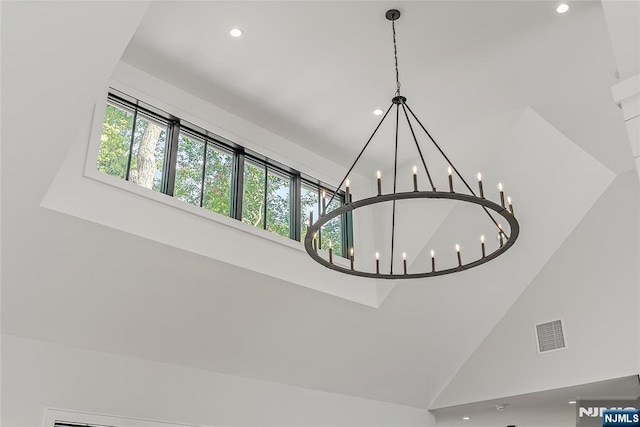 interior details with a notable chandelier, recessed lighting, and visible vents