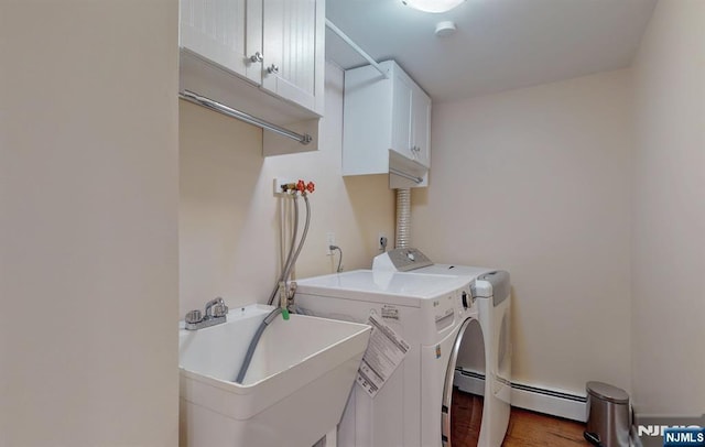 30 Brookvale Rd, Kinnelon Borough, NJ 07405 - washroom featuring cabinet space, baseboard heating, washer and clothes dryer, and wood finished floors