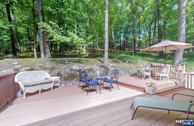 30 Brookvale Rd, Kinnelon Borough, NJ 07405 - wooden terrace with outdoor dining space and view of scattered trees
