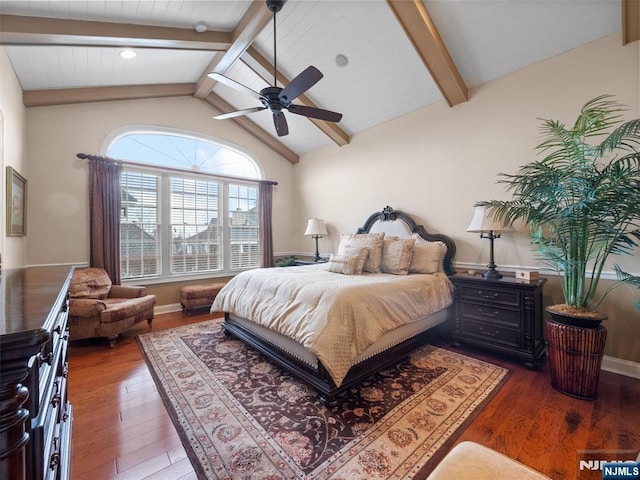 bedroom featuring lofted ceiling with beams, ceiling fan, dark wood finished floors, and baseboards