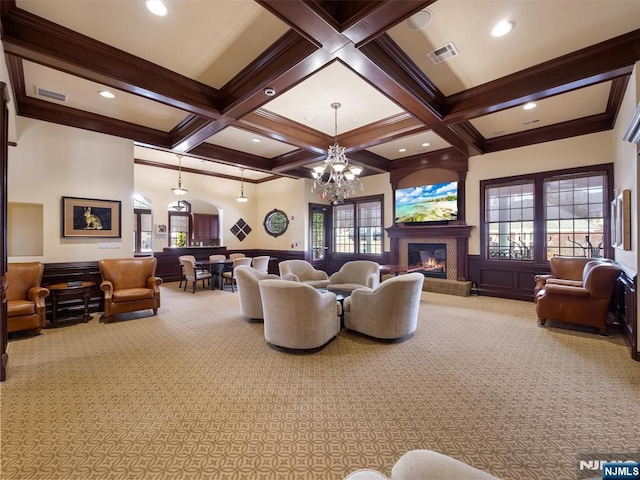 living area featuring visible vents, coffered ceiling, and beam ceiling